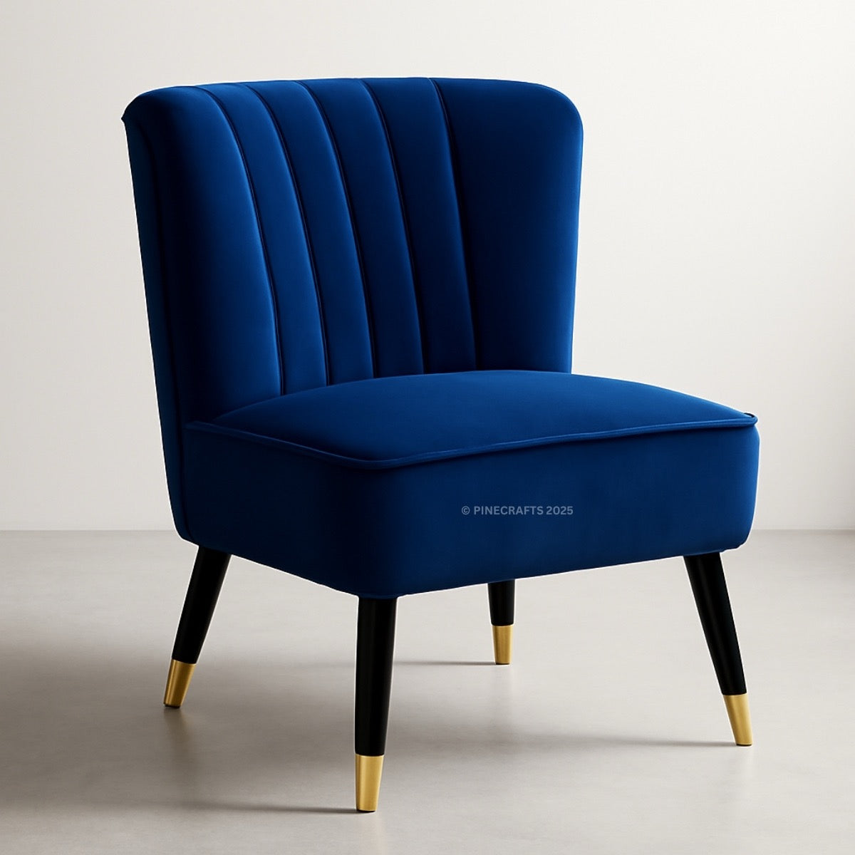 Blue velvet chair with gold feet on a light gray background